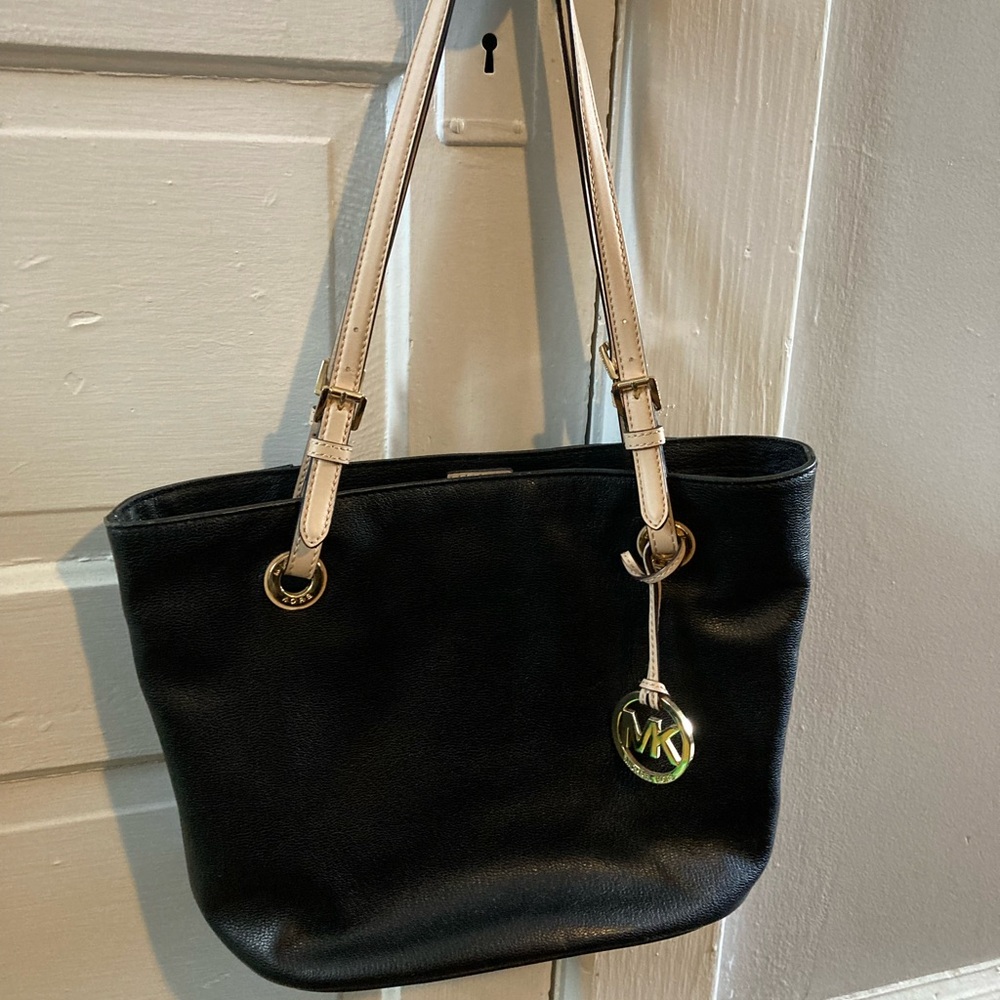 Michael Kors Black leather handbag. Medium size.  Never used and is authentic